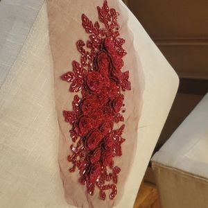 Gorgeous burgundy applique with crystals and beading.